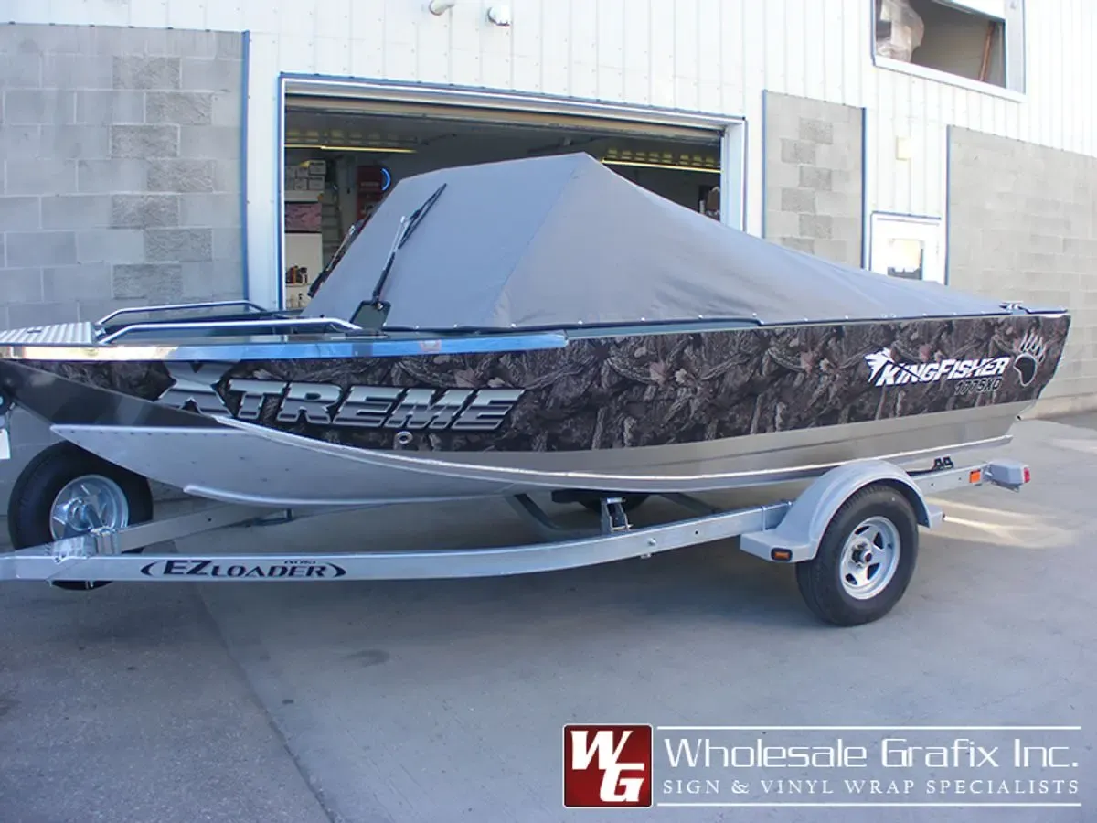 Aluminum boat wrapped in a camouflage pattern