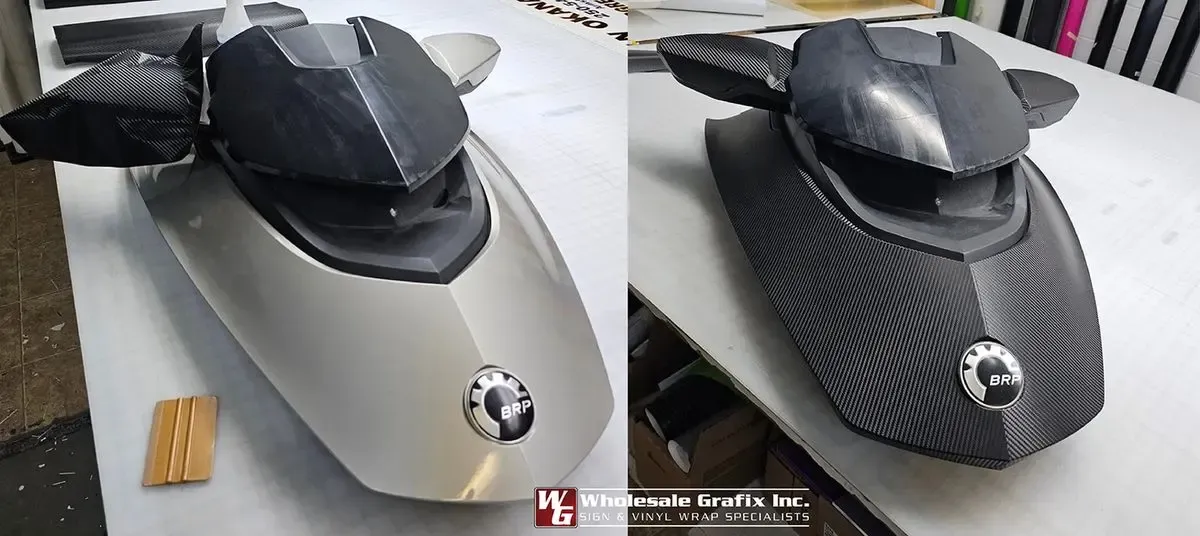 Hockey goalie mask wrapped in a custom black and red design by Wholesale Grafix