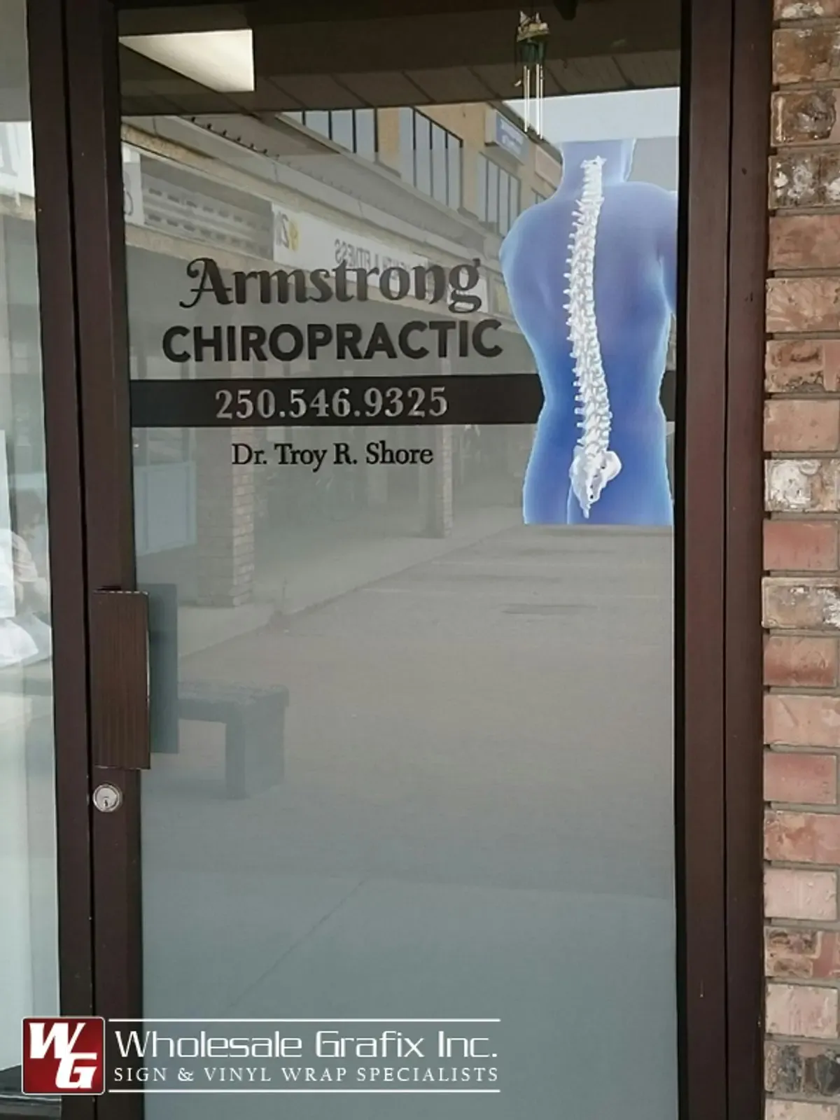 Armstrong Chiropractic door graphics with a spine illustration