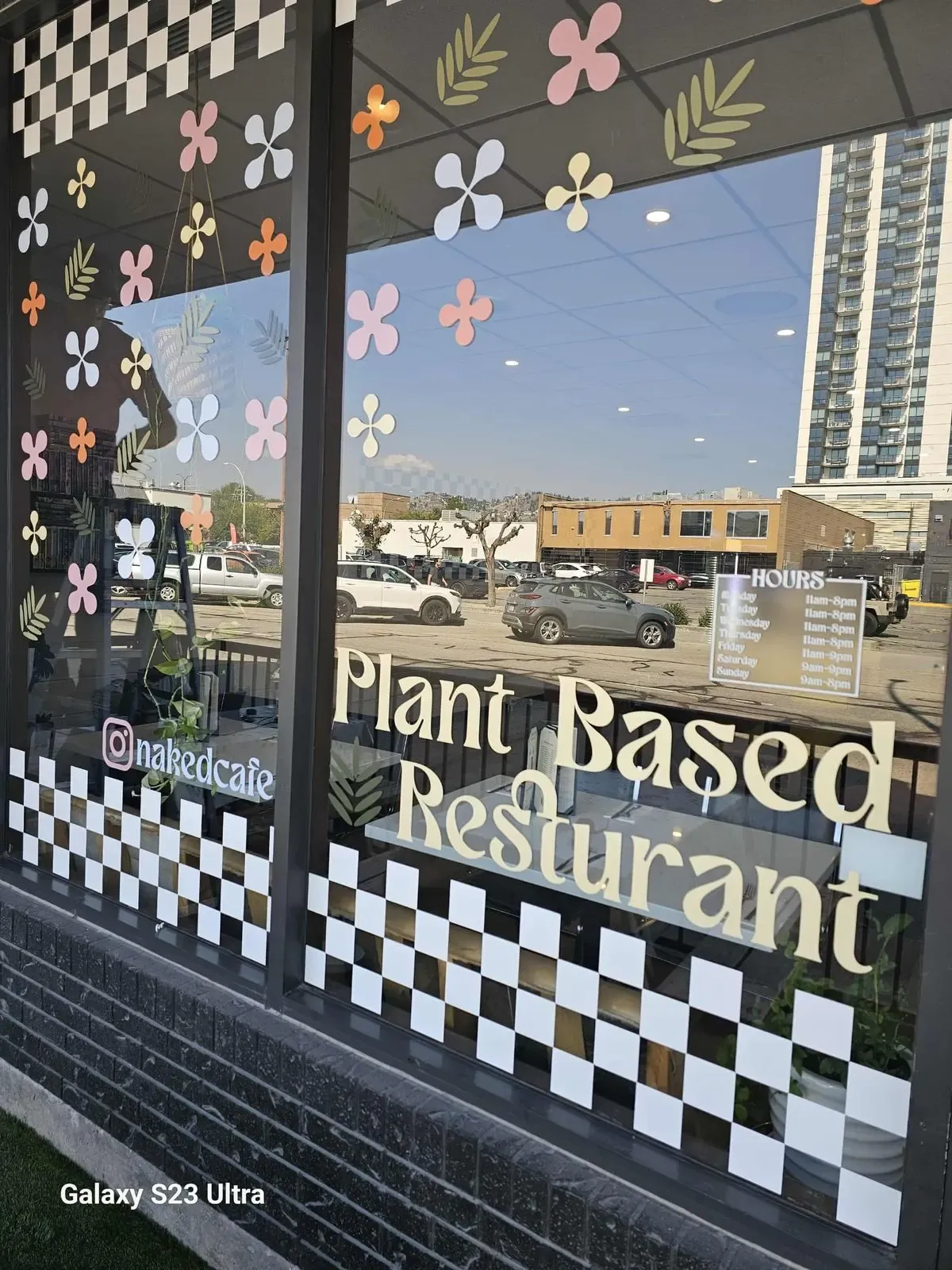 Plant-based restaurant storefront window with cut vinyl lettering and graphics by Wholesale Grafix
