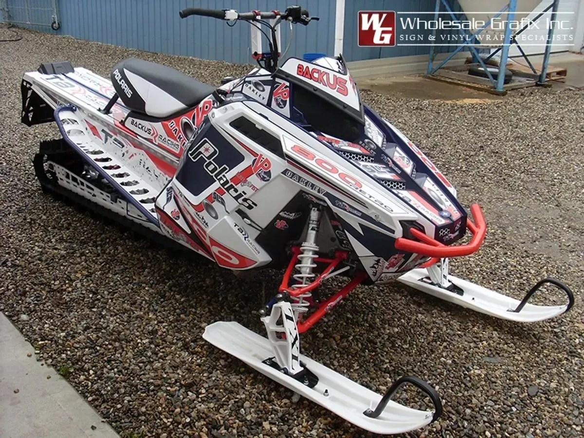 Polaris mountain sled in a red and white Baldy wrap