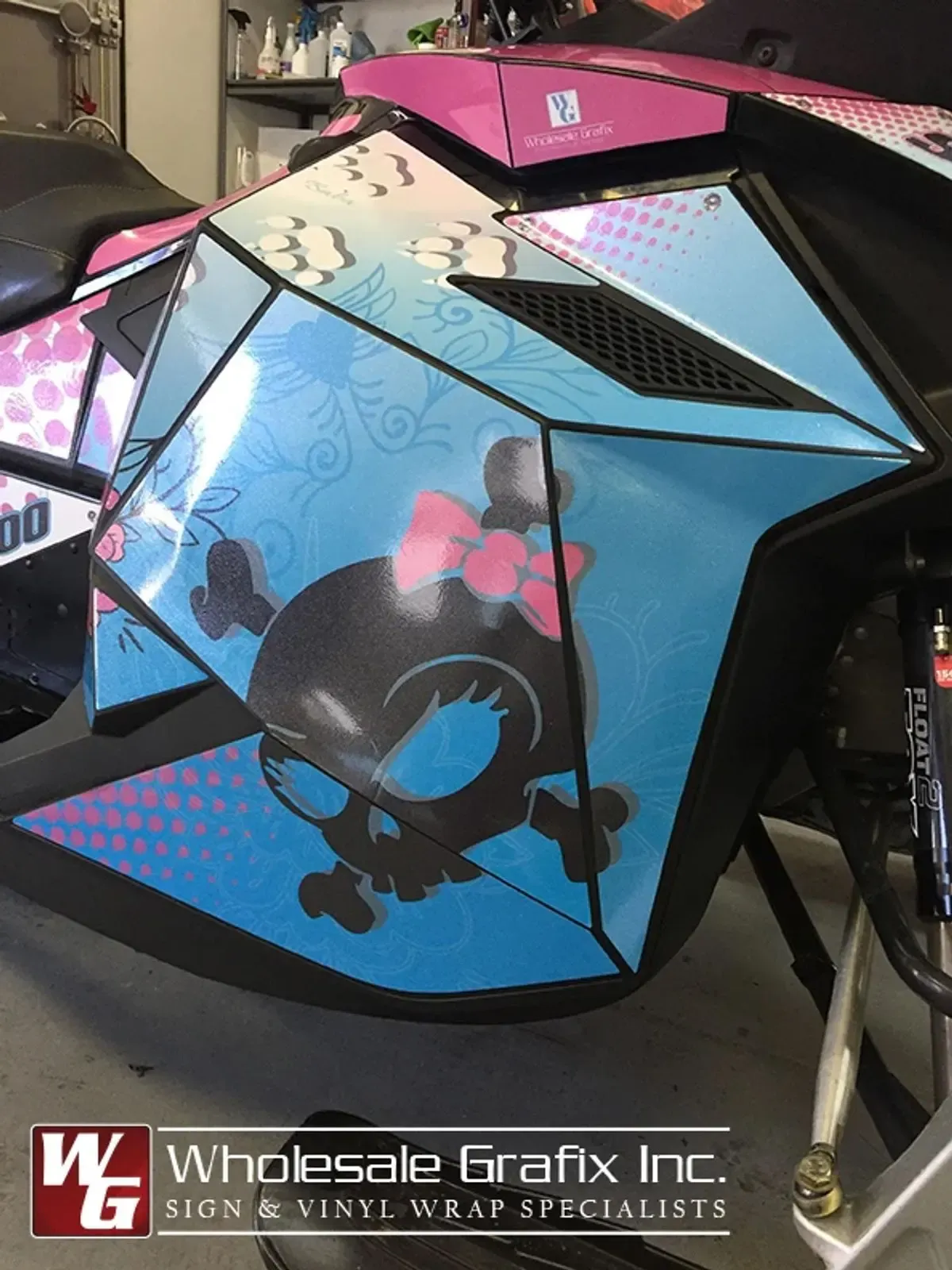 Mountain sled in a bright custom colour-change wrap