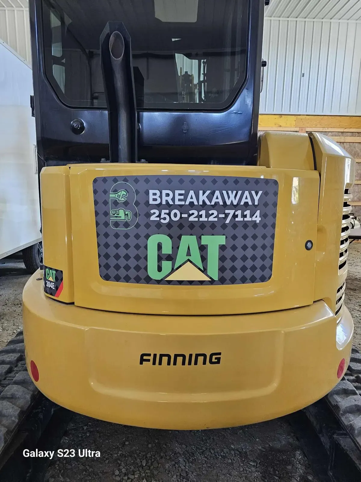 CAT mini excavator with Breakaway Plumbing decals applied by Wholesale Grafix