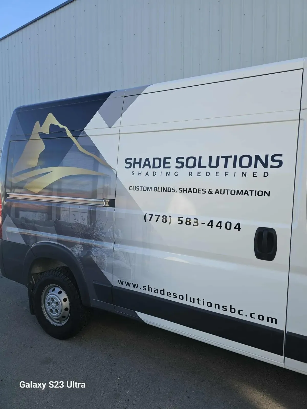 Shade Solutions cargo van fully wrapped in blue and gold graphics by Wholesale Grafix